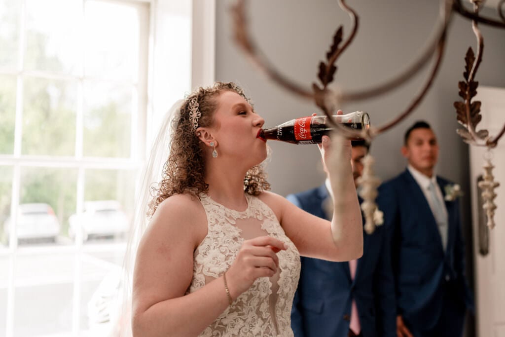 Bride with a coca cola stone house wedding venue
