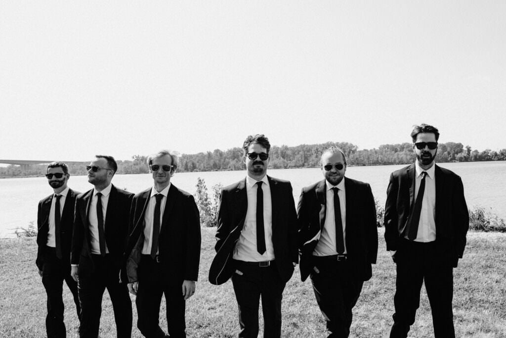 Groom and groomsmen by the lake.