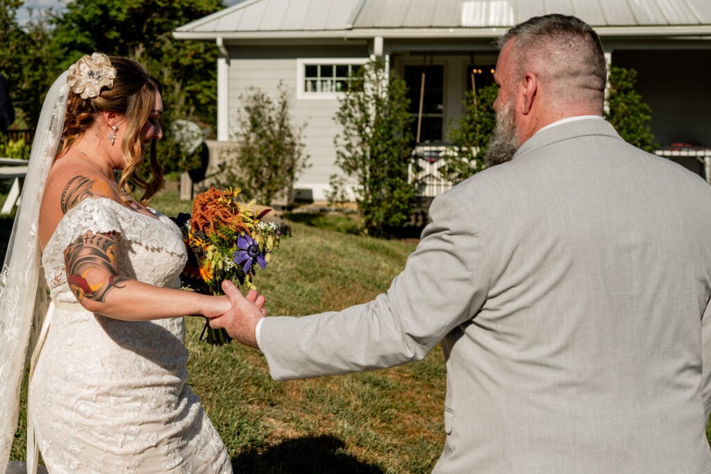Sun Flower Hill Farm bride groom holding hands outdoor wedding setting