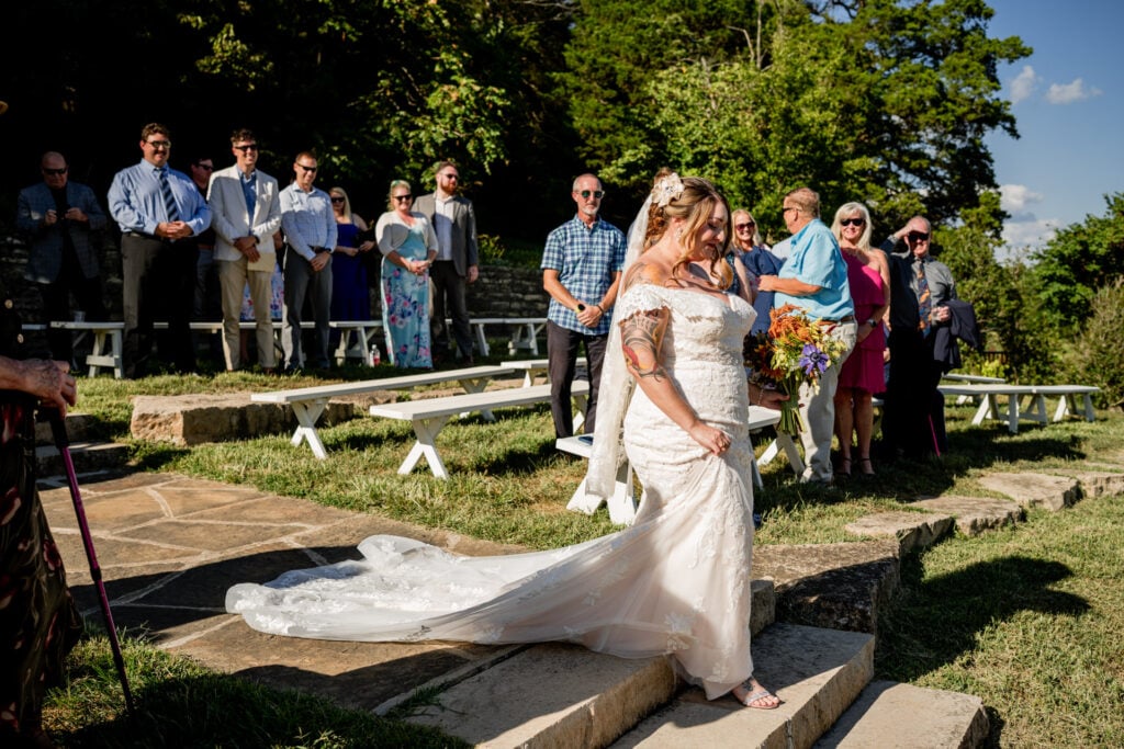 Sun Flower Hill Farm bride groom walking stairs guests watching smiling