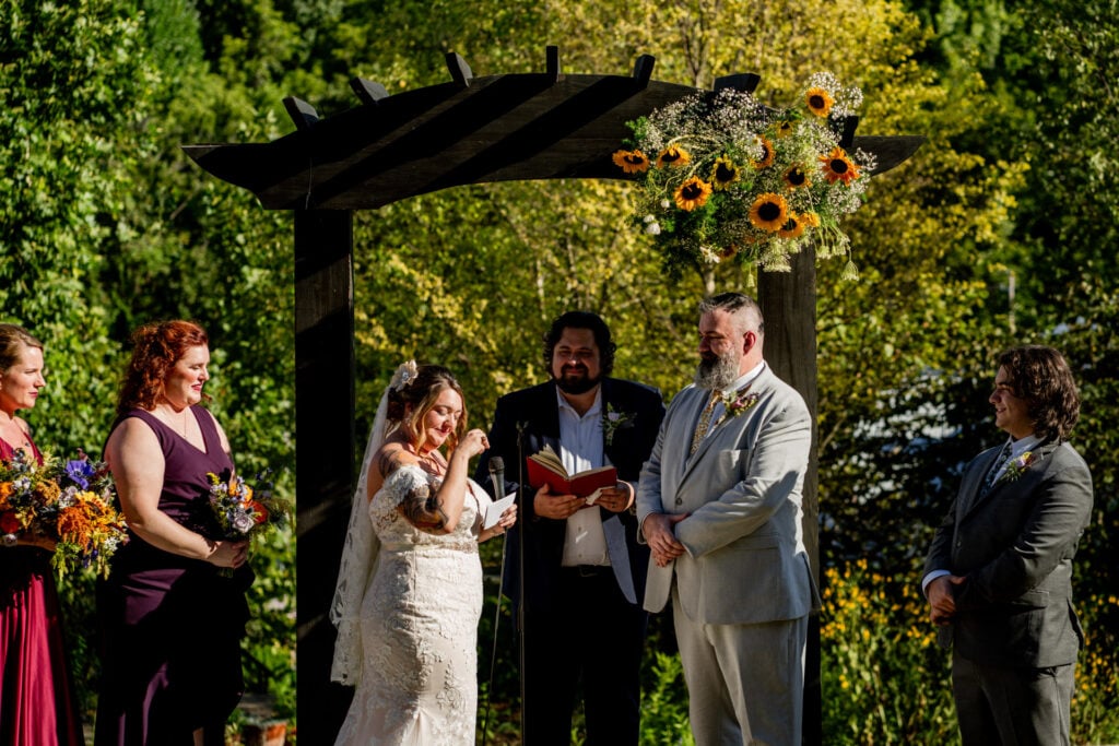 Sun Flower Hill Farm outdoor wedding ceremony sunflowers bride crying groom smiling