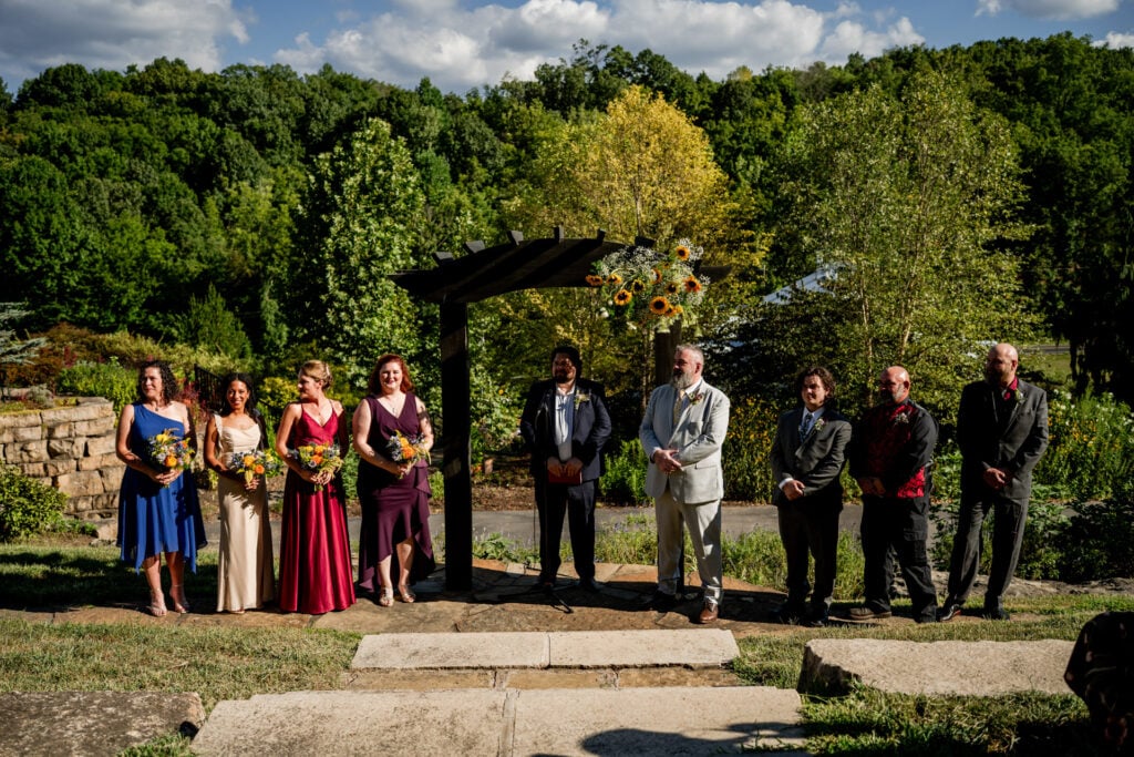 Sun Flower Hill Farm outdoor wedding ceremony with bridal party and officiant