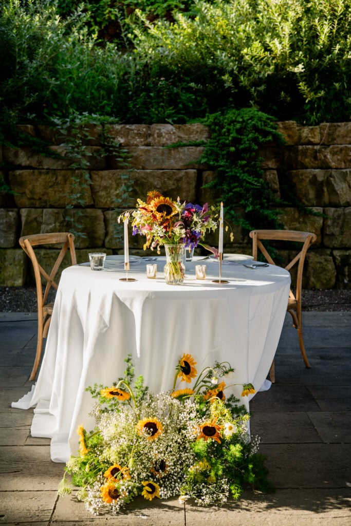 sunflowers white table rustic chairs outdoor setting Sunflower Hill Farm
